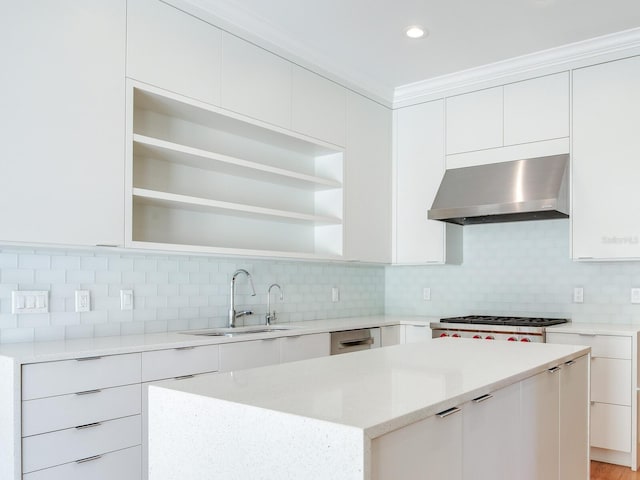 kitchen featuring wall chimney exhaust hood, a center island, white cabinets, modern cabinets, and recessed lighting