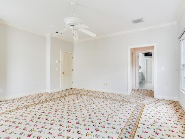 unfurnished room featuring baseboards, ceiling fan, and ornamental molding