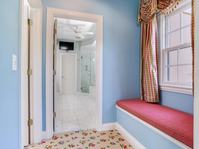 corridor featuring baseboards