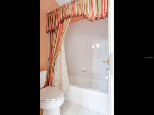 bathroom featuring toilet, tile patterned floors, and shower / bathtub combination with curtain