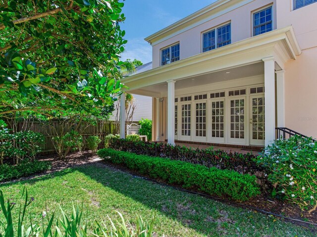 view of side of property featuring stucco siding and brick siding