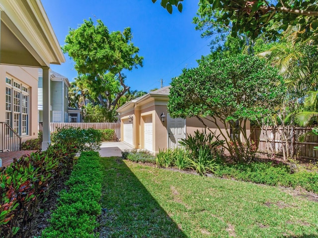 view of yard featuring an attached garage