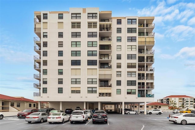 6265 Sun Blvd Unit 1201, Saint Petersburg, FL 33715 - view of property featuring uncovered parking