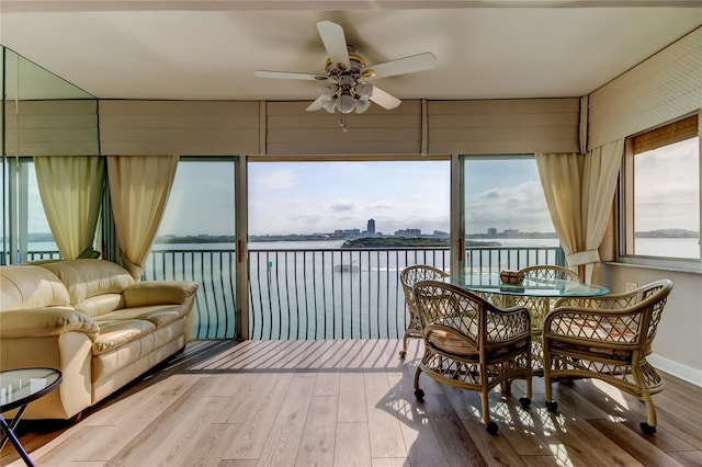 895 S Gulfview Blvd Unit 309, Clearwater Beach, FL 33767 - dining area with a water view, wood finished floors, and ceiling fan