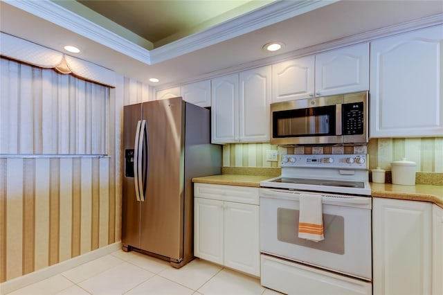 895 S Gulfview Blvd Unit 309, Clearwater Beach, FL 33767 - kitchen with recessed lighting, light countertops, white cabinets, and stainless steel appliances