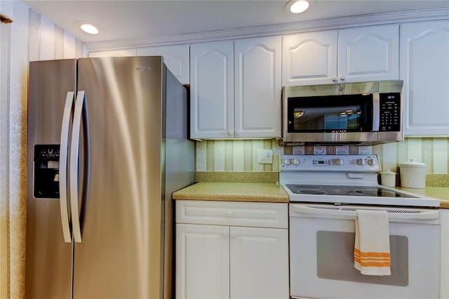 895 S Gulfview Blvd Unit 309, Clearwater Beach, FL 33767 - kitchen with white cabinets, light countertops, recessed lighting, and stainless steel appliances