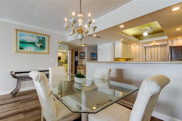 895 S Gulfview Blvd Unit 309, Clearwater Beach, FL 33767 - dining space with crown molding, wood finished floors, baseboards, visible vents, and recessed lighting