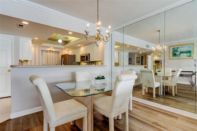 895 S Gulfview Blvd Unit 309, Clearwater Beach, FL 33767 - dining room with visible vents, crown molding, baseboards, wood finished floors, and recessed lighting