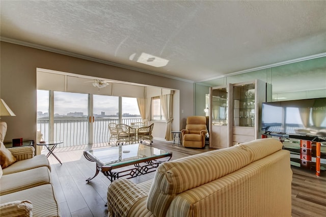 895 S Gulfview Blvd Unit 309, Clearwater Beach, FL 33767 - living room featuring crown molding, wood finished floors, and a textured ceiling