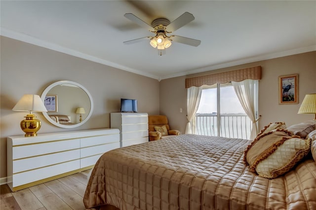 895 S Gulfview Blvd Unit 309, Clearwater Beach, FL 33767 - bedroom featuring a ceiling fan, crown molding, access to exterior, and wood finished floors