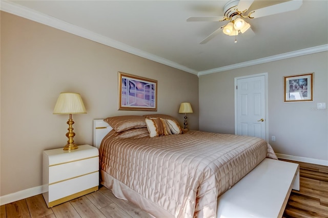 895 S Gulfview Blvd Unit 309, Clearwater Beach, FL 33767 - bedroom with a ceiling fan, ornamental molding, baseboards, and wood finished floors