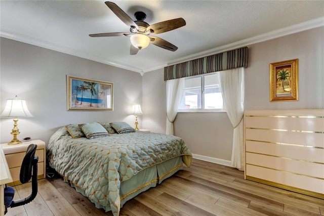 895 S Gulfview Blvd Unit 309, Clearwater Beach, FL 33767 - bedroom with baseboards, ornamental molding, light wood-style floors, and ceiling fan