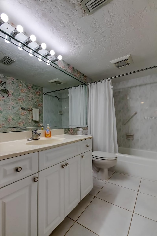 895 S Gulfview Blvd Unit 309, Clearwater Beach, FL 33767 - full bath with a textured ceiling, visible vents, tile patterned floors, vanity, and shower / bathtub combination with curtain