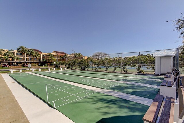 895 S Gulfview Blvd Unit 309, Clearwater Beach, FL 33767 - view of property's community with shuffleboard and fence