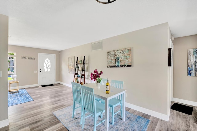 11361 88th Ave, Seminole, FL 33772 - dining space with light wood-type flooring and baseboards