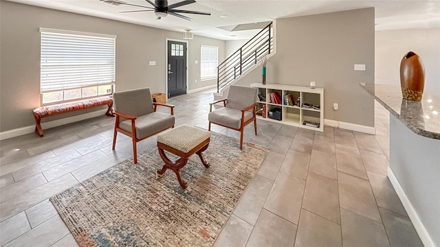 5235 Nichols Dr E, Lakeland, FL 33812 - living area with baseboards, stairs, and ceiling fan
