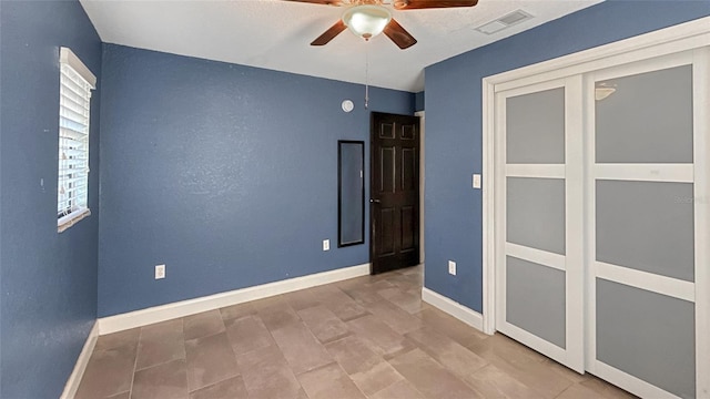 5235 Nichols Dr E, Lakeland, FL 33812 - unfurnished room featuring baseboards, visible vents, and a ceiling fan