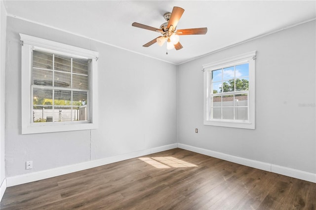unfurnished room with ornamental molding, baseboards, ceiling fan, and wood finished floors