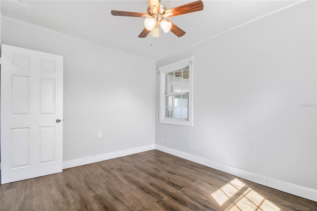 unfurnished room with baseboards, ceiling fan, and wood finished floors