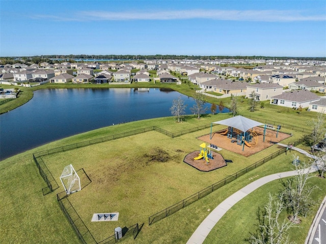 birds eye view of property featuring a water view and a residential view