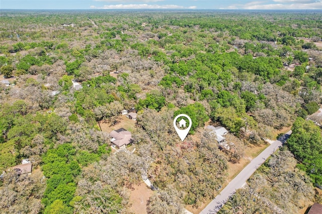 bird's eye view featuring a wooded view