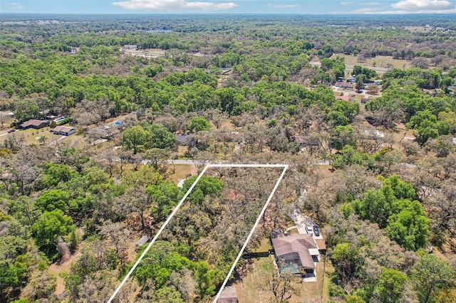 aerial view with a wooded view