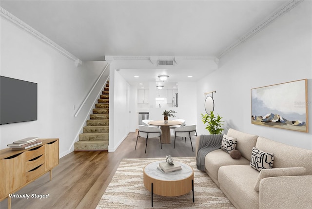 4215 S Semoran Blvd Unit 3, Orlando, FL 32822 - living room with stairway, wood finished floors, crown molding, and recessed lighting