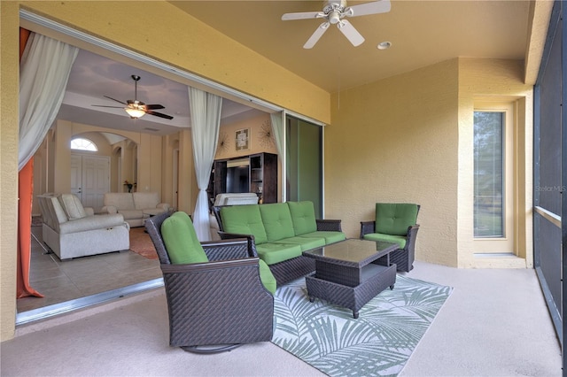 view of patio featuring an outdoor living space and a ceiling fan