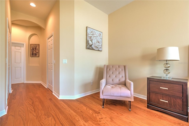 2218 132nd Pl E, Parrish, FL 34219 - sitting room with arched walkways, light wood-style floors, recessed lighting, and baseboards