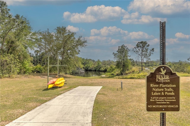 2218 132nd Pl E, Parrish, FL 34219 - surrounding community featuring a lawn and a water view