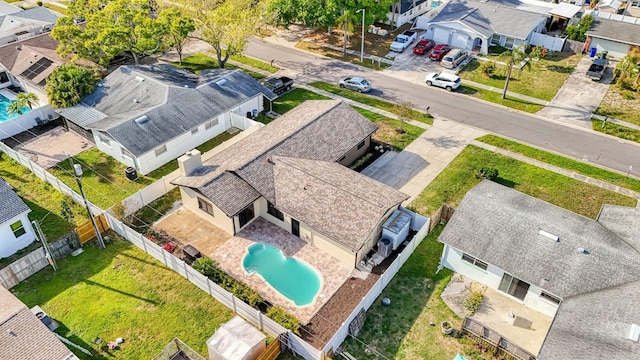 aerial perspective of suburban area with a pool area