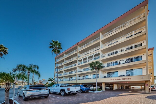 13000 Gulf Blvd Unit 109, Madeira Beach, FL 33708 - view of property featuring uncovered parking