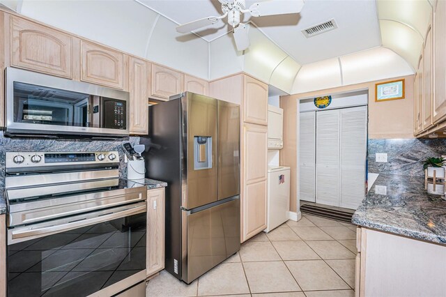 13000 Gulf Blvd Unit 109, Madeira Beach, FL 33708 - kitchen with light brown cabinets, visible vents, decorative backsplash, stainless steel appliances, and ceiling fan