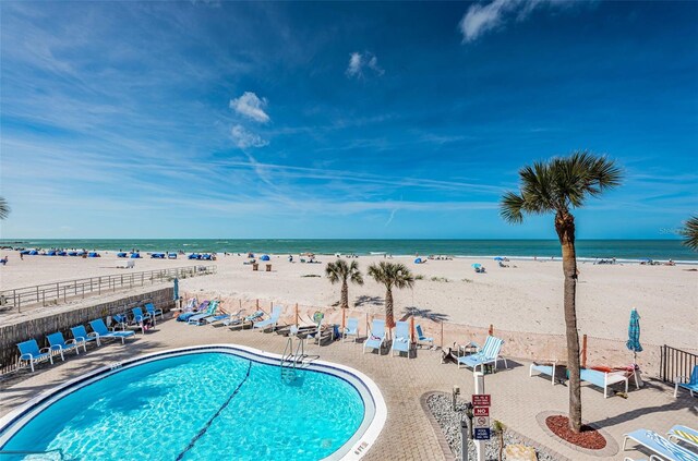 13000 Gulf Blvd Unit 109, Madeira Beach, FL 33708 - community pool with a water view, a patio area, fence, and a view of the beach