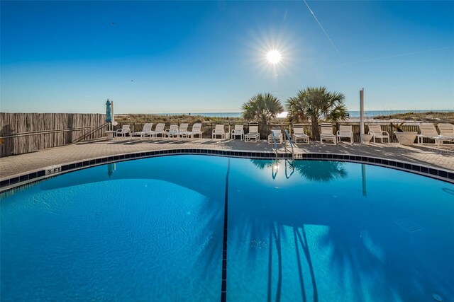 13000 Gulf Blvd Unit 109, Madeira Beach, FL 33708 - community pool featuring fence and a patio