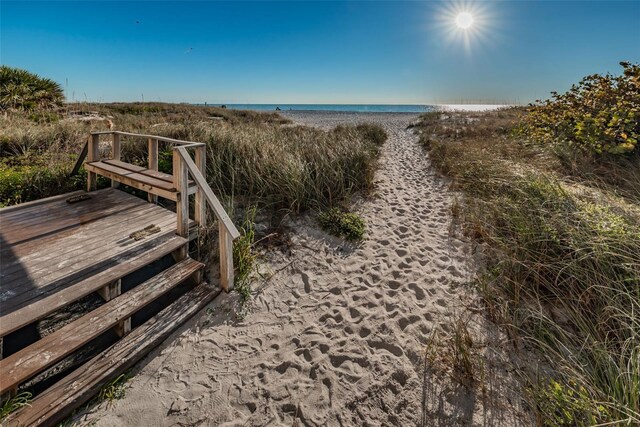 13000 Gulf Blvd Unit 109, Madeira Beach, FL 33708 - view of property's community featuring a deck with water view and a view of the beach