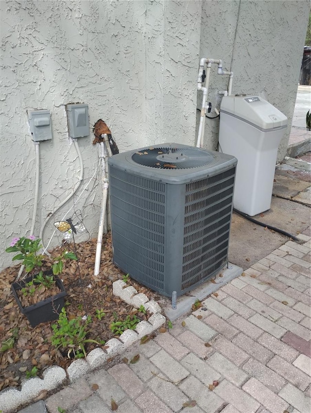 14633 Sassandra Dr, Odessa, FL 33556 - details with cooling unit and stucco siding