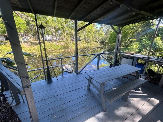 14633 Sassandra Dr, Odessa, FL 33556 - wooden deck featuring a view of trees and outdoor dining space