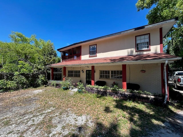 14633 Sassandra Dr, Odessa, FL 33556 - view of front of home with a balcony and brick siding