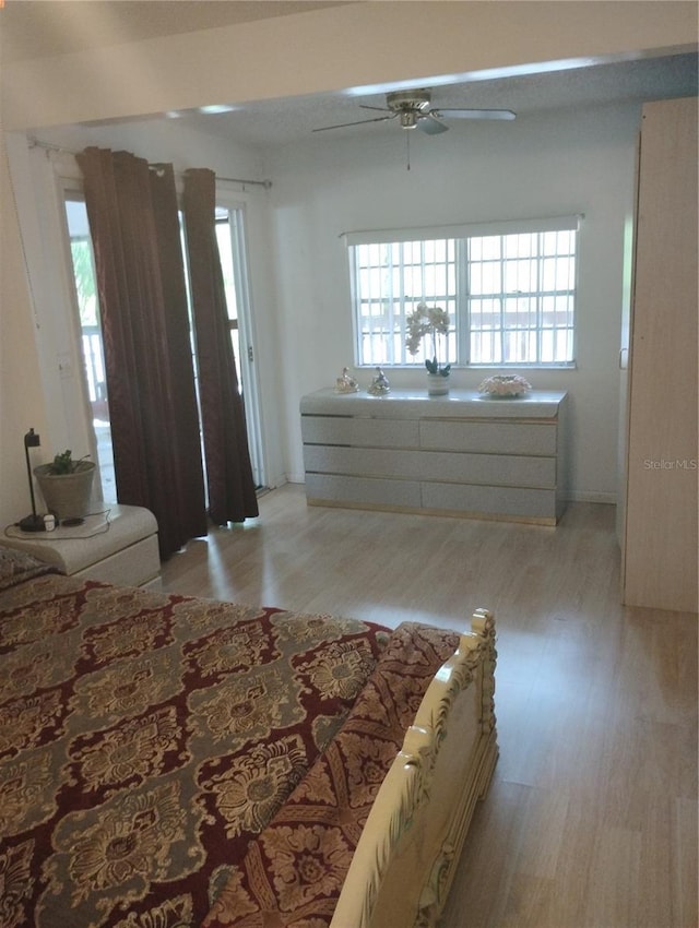 14633 Sassandra Dr, Odessa, FL 33556 - bedroom with light wood-style flooring and a ceiling fan