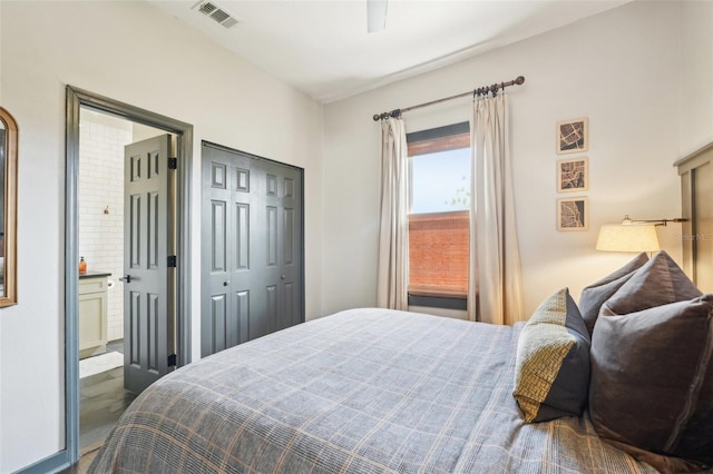 bedroom with connected bathroom, visible vents, and ceiling fan