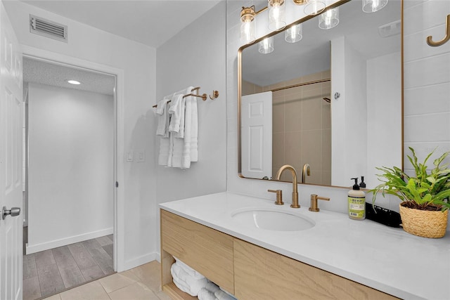 2116/2114 1st St, Indian Rocks Beach, FL 33785 - bathroom with vanity and baseboards