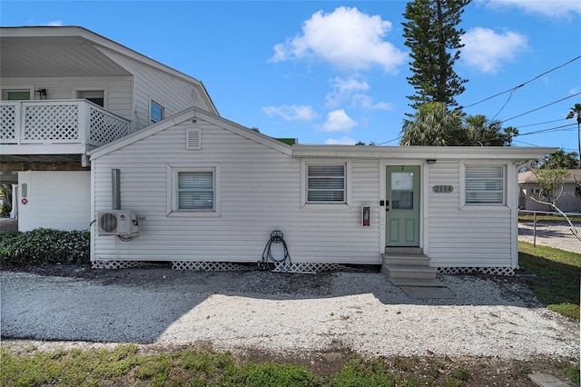 2116/2114 1st St, Indian Rocks Beach, FL 33785 - view of front facade featuring entry steps and a cooling unit