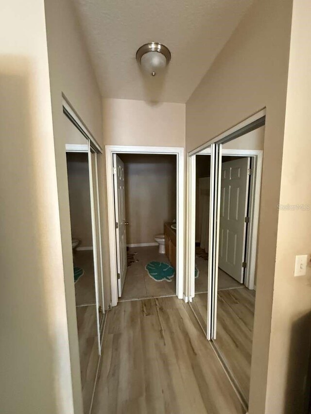 1185 SW 9th Rd Unit 107, Gainesville, FL 32601 - corridor with light wood-type flooring