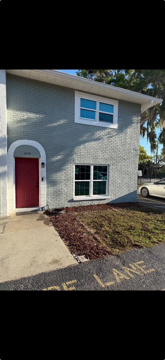 5715 Townhouse Dr Unit 1, New Port Richey, FL 34652 - view of front of home with brick siding