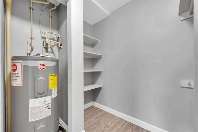 utility room featuring water heater