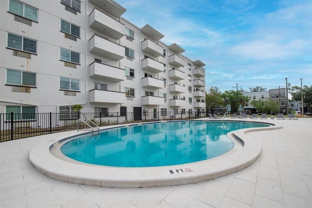 view of pool with fence