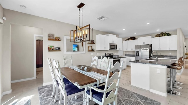 dining area featuring recessed lighting, visible vents, light tile patterned floors, baseboards, and a notable chandelier