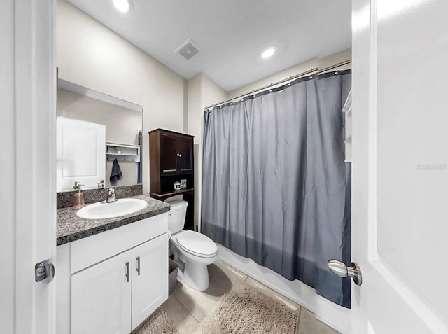 bathroom featuring visible vents, tile patterned flooring, vanity, and toilet