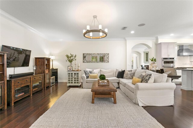 4310 W Sevilla St, Tampa, FL 33629 - living room with a chandelier, dark wood-type flooring, visible vents, arched walkways, and ornamental molding